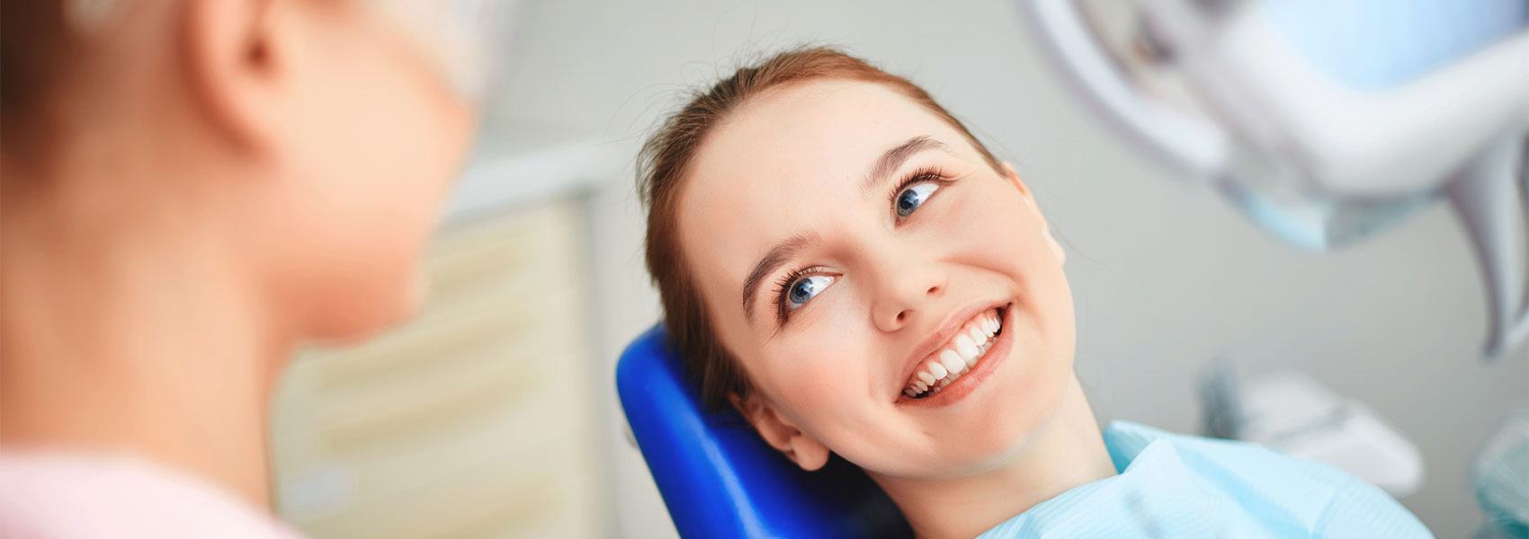 Beautiful woman smiling in dental